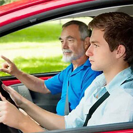 A man and his son are driving in the car.